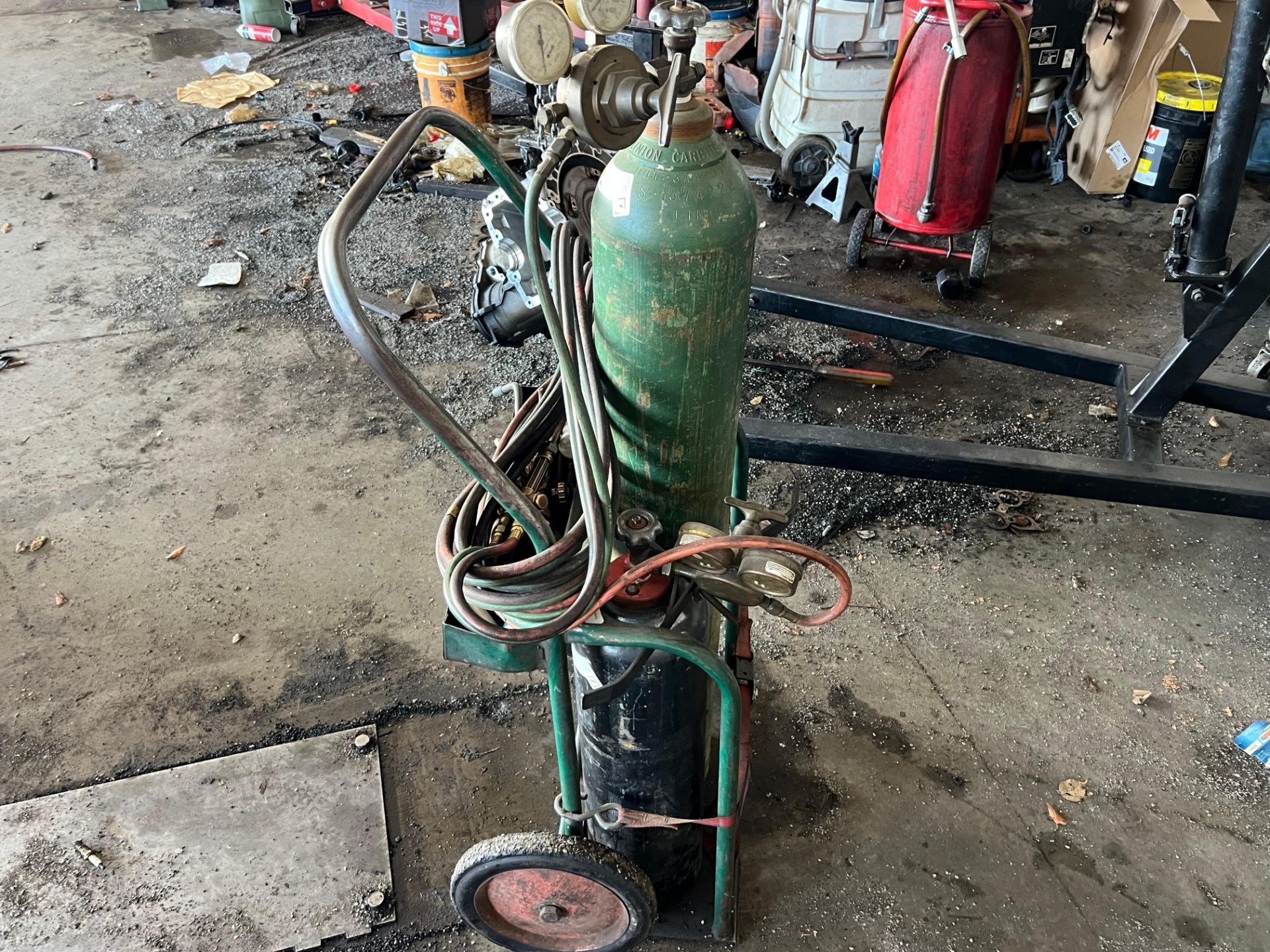 Description: Offered at auction is a oxy-acetylene torch and regulator ...