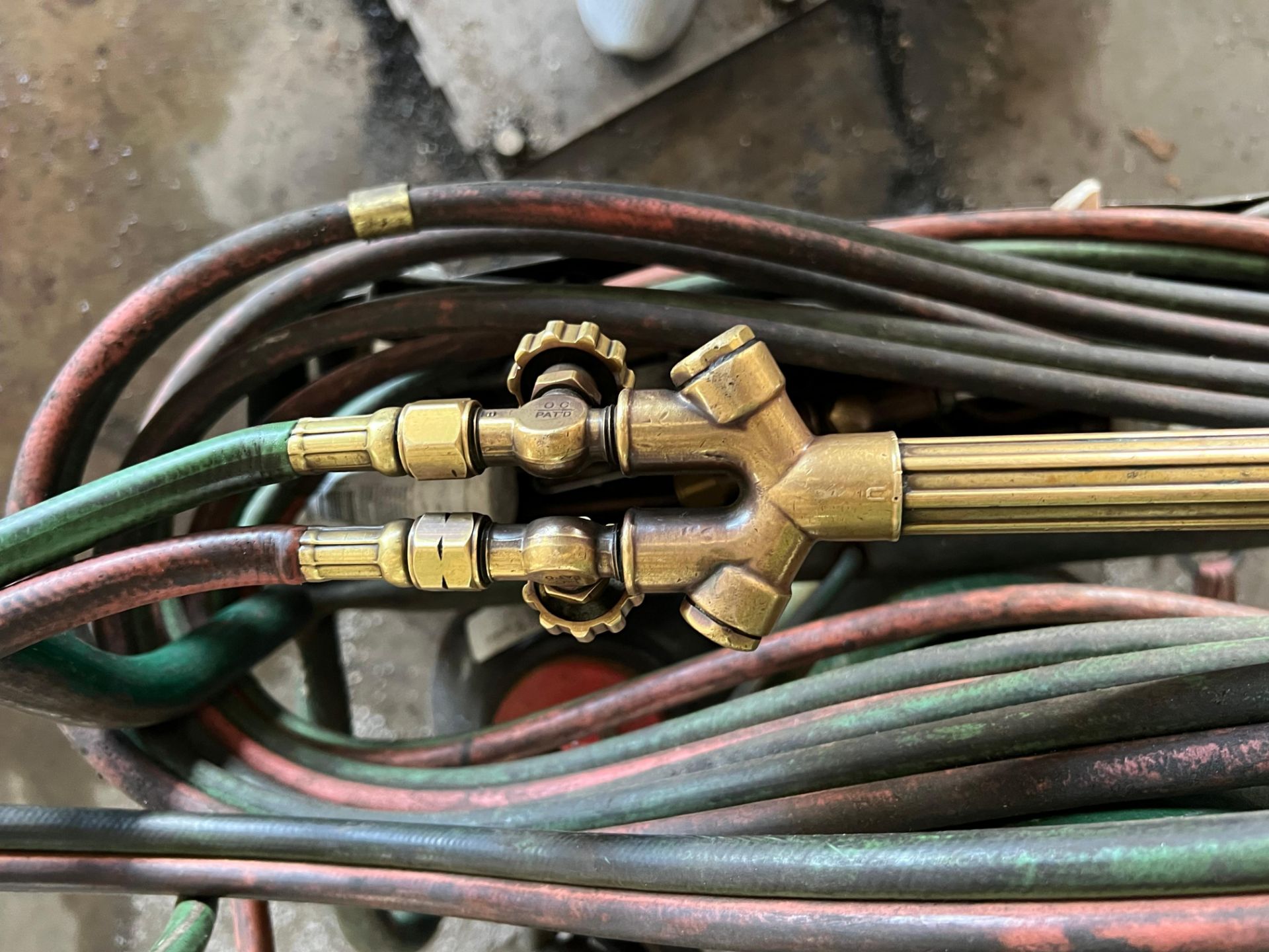 Description: Offered at auction is a oxy-acetylene torch and regulator ...