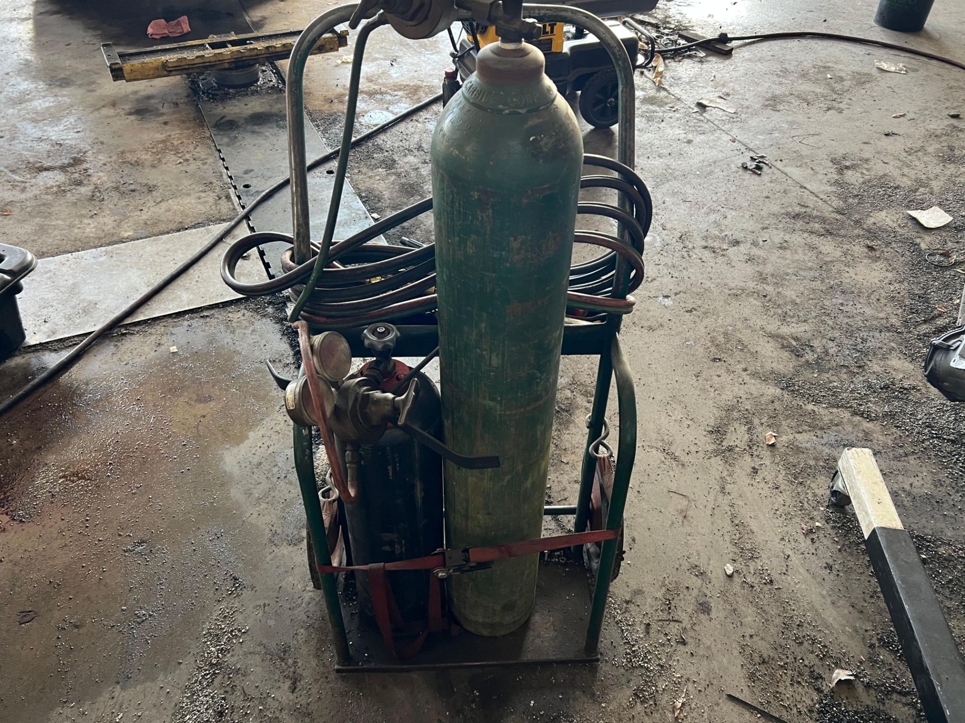 Description: Offered at auction is a oxy-acetylene torch and regulator ...