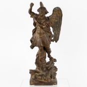 Saint Michael Defeating the Devil, a Cast Iron Statue.
