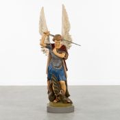 Saint Michael and the Dragon, a patinated plaster statue, Gothic Revival Style.