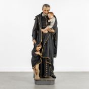 Saint Vincent de Paul, polychrome patinated plaster.