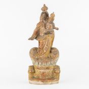 A Patinated Terracotta Statue of a Crowned Madonna and Child, flanked by Cherub Heads, 19th C.