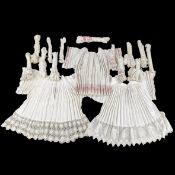 Lithurgical Vestments: 17 Albs and Rochets, finished with lacework and corchet.