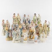 A Large Collection of 17 Saint Figurines, the Holy Family, and Christ with the Sacred Heart, biscuit
