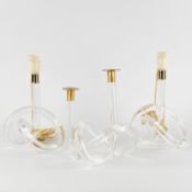 Dorothy Thorpe Inc., 'Pretzel', a pair of table lamps and a candelabra, lucite and gilded metal, cir