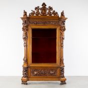 An Exceptional Italian display cabinet, walnut, decorated with the Lion of Saint Mark, caryatids, an