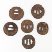 Six Japanese Tsuba, wrought iron, decorated with dragons, landscapes, and flowers, Edo-Meiji period,