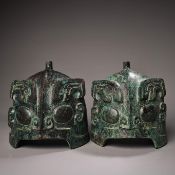 A pair of bronze helmets