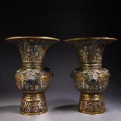 A pair of bronze vases inlaid with gold and silver