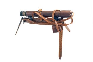 A Rifle Scope on a Alfred Parker Stand.