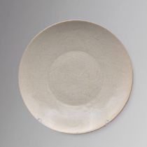 A CHINESE INCISED WHITE POTTERY DISH SOUTHERN SONG DYNASTY