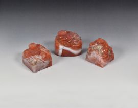 A SET OF THREE CHINESE CARNELIAN 'CHILONG' SEALS QING DYNASTY, 18TH/19TH CENTURY