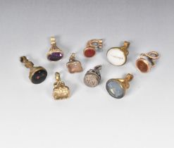 A COLLECTION OF NINE GILT-METAL SMALL FOB SEALS 19TH CENTURY