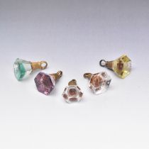 FIVE NOVELTY COLOURED GLASS AND GILT-METAL SEAL FOBS CIRCA 1840
