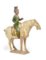 A CHINESE SANCAI-GLAZED POTTERY FEMALE EQUESTRIAN TANG DYNASTY, (618-907CE)