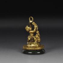 A GILT-METAL NOVELTY 'CUPID' FOB SEAL 19TH CENTURY