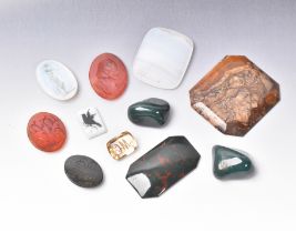 A COLLECTION OF GEM-STONE AND GLASS SEAL MATRIX'S
