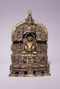 An Indian Jain Bronze Shrine with Seated Tirthankara, 19th Century. The bronze cast as a portable