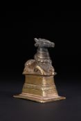 A SOUTHERN INDIAN OR DECCAN BRONZE VOTIVE FIGURE OF NANDI, 18TH/19TH CENTURY.