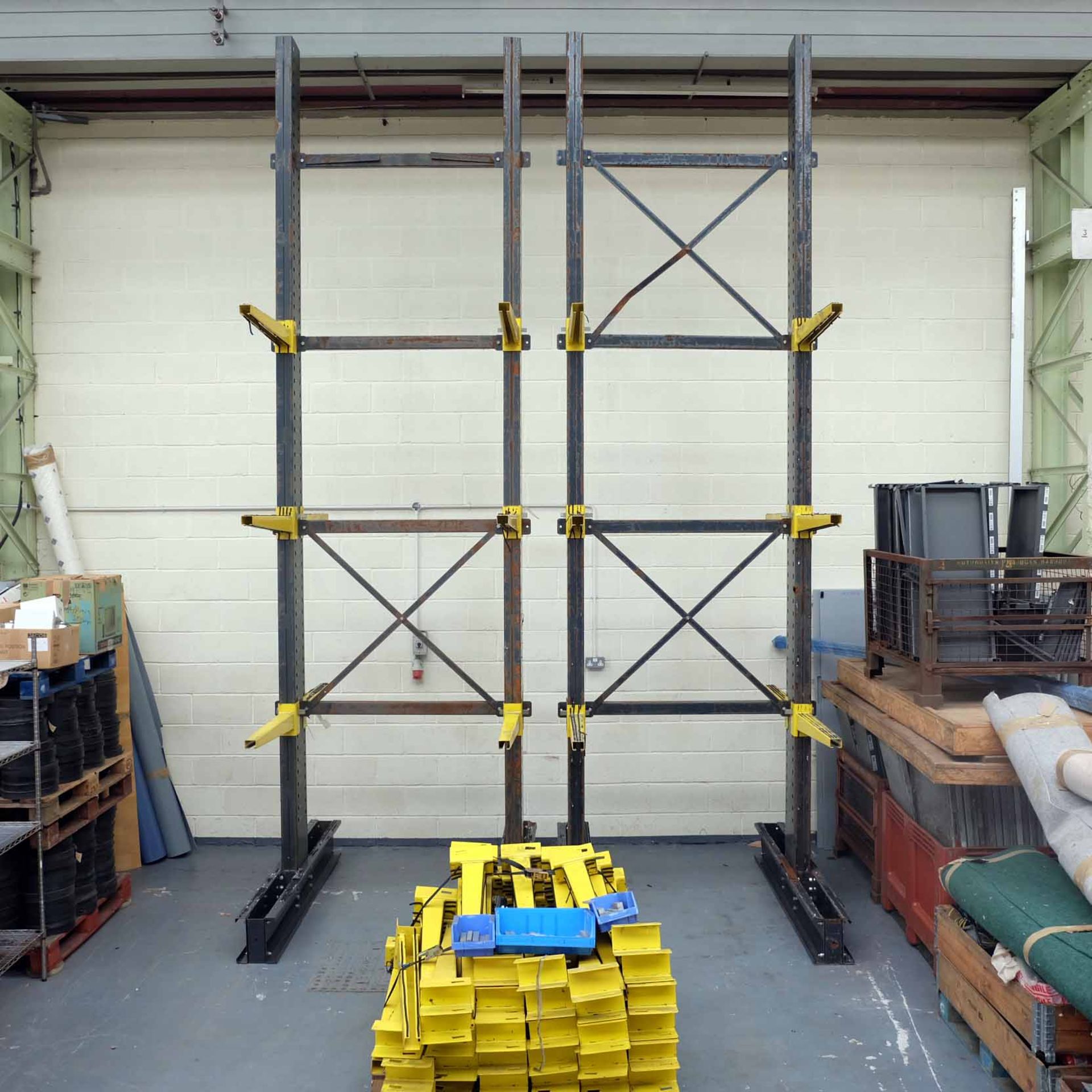 Double Sided Tall Racking. Approx Height 5.4m. 1620mm x 1900mm Approx. Pallet of Arms 825mm Long. 