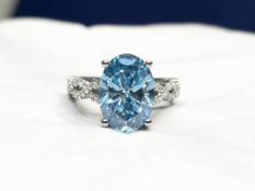 Oval Cut Fancy Blue Diamond Ring 5.20 Carat Set in A Platinum Twisted Band Set with Round Diamonds