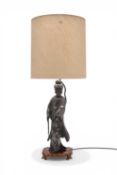 A large Chinese pewter figural table lamp, modelled as Guanyin