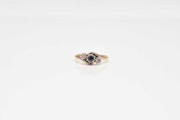 A graduated sapphire and diamond ring