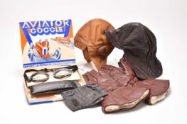 An assembled group of vintage motoring accessories and apparel
