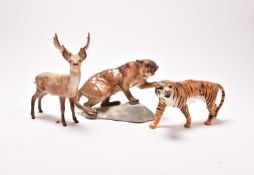 Three Beswick figures: Puma, Tigress, and Stag
