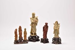 A group of Chinese carved soapstone figures of immortals