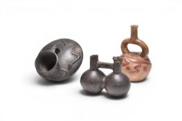 A group of three Peruvian earthenware vessels