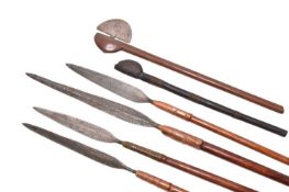 A group of African tribal spears and throwing axes