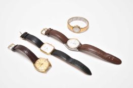 A group of four wristwatches