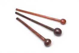 A collection three of African tribal knobkerrie war clubs