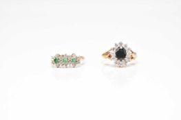 A 9ct gold emerald and white stone cluster ring