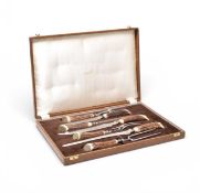 A cased deer antler handled carving set
