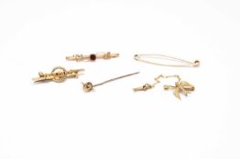 A collection of brooches and pins