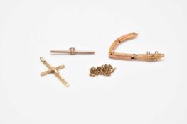 A broken expandable watch bracelet, a yellow metal T-bar and a crucifix pendant