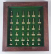 Framed display of inert ammunition cartridges, with some bullets and balls