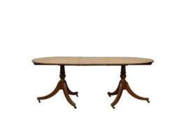 A George III style mahogany twin-pedestal dining table