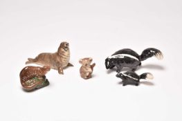 Beswick models of two skunks, a seal, an otter and a koala