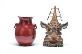 A Chinese sang de boeuf vase and a Chilean jewelled copper mask