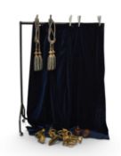 A pair of gilt metal curtain brackets with curtain rod and a pair of curtains