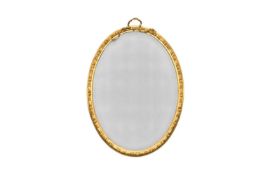 A large giltwood Regency revival oval wall mirror
