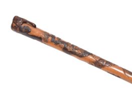 A Japanese carved Malacca cane