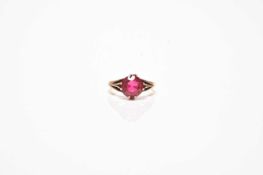 A single stone synthetic ruby ring