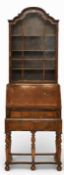 A William and Mary style walnut glazed bureau bookcase