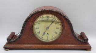 Lloyd Payne and Amiel. An Edwardian mahogany Napoleon Hat shape mantle clock with 4 1/2 inch brass