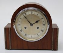 A walnut cased mantle clock by Enfield